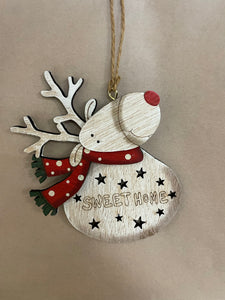 Wooden reindeer with scarf and saying