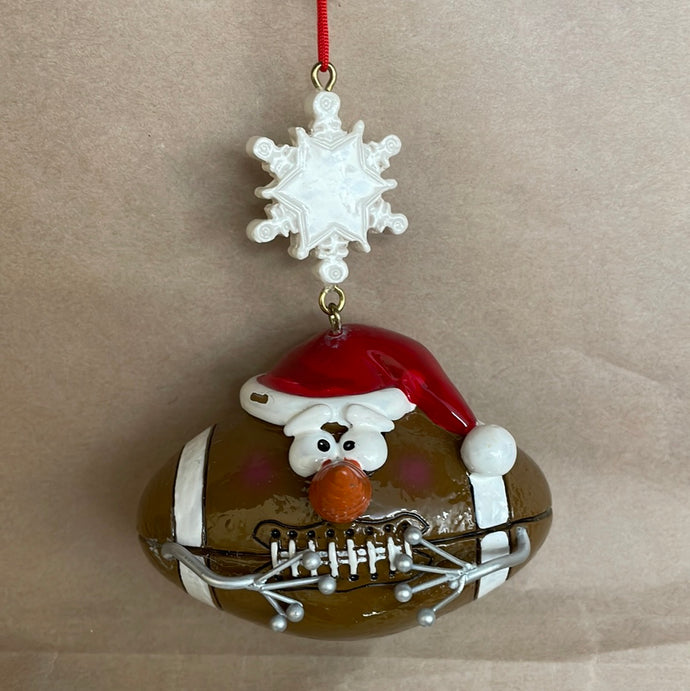 Sports ball with face ornament